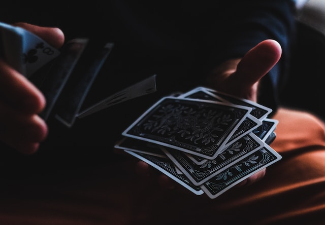 Hands Shuffling a Deck of Cards