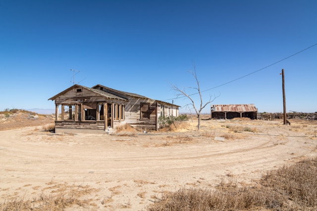 Abandoned farmhouse and barn in the desert